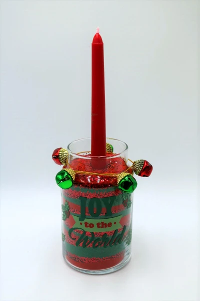 Fill a mason jar with colored sand to make a pretty candle holder for Christmas!